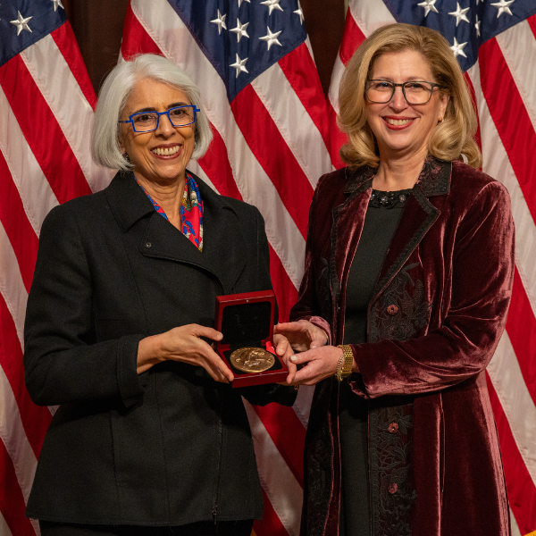 Teresa Woodruff (at right) is awarded the National Medal of Science by Arati Prabhakar, director of the White House Office of Science and Technology Policy, at a ceremony at the Eisenhower Executive Office Building in Washington, D.C., on, Jan. 3. Photo courtesy of Ryan K. Morris and the National Science & Technology Medals Foundation